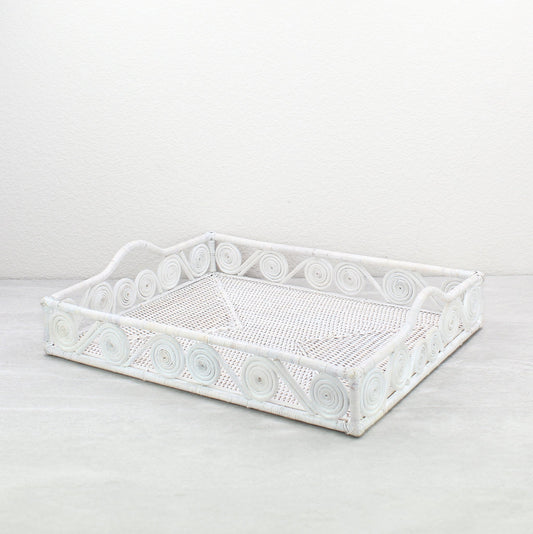 Whitewash rectangular rattan tray with swirl design and raised handles, handmade in a whitewash finish for serving, organizing, or home décor.