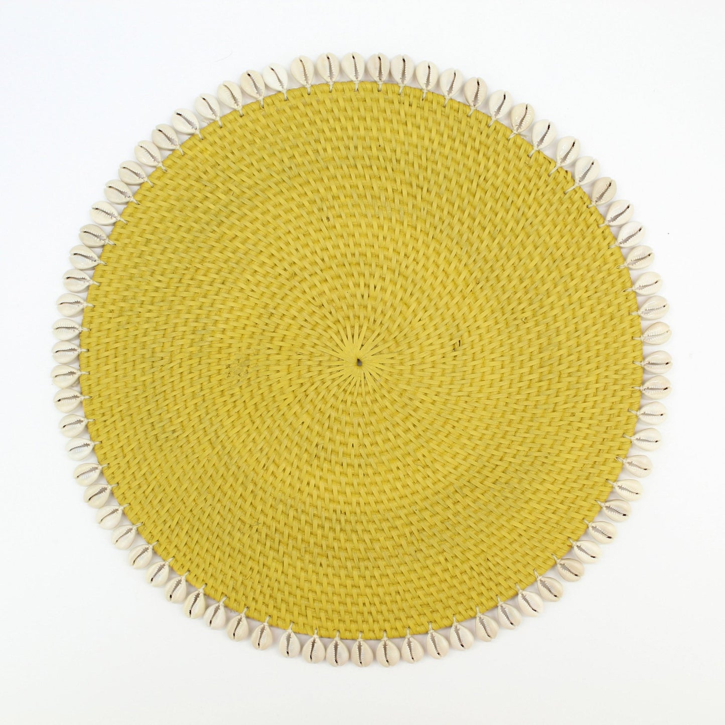 Handmade yellow rattan placemat with natural seashell trim, shown on white background for clean, product-only display