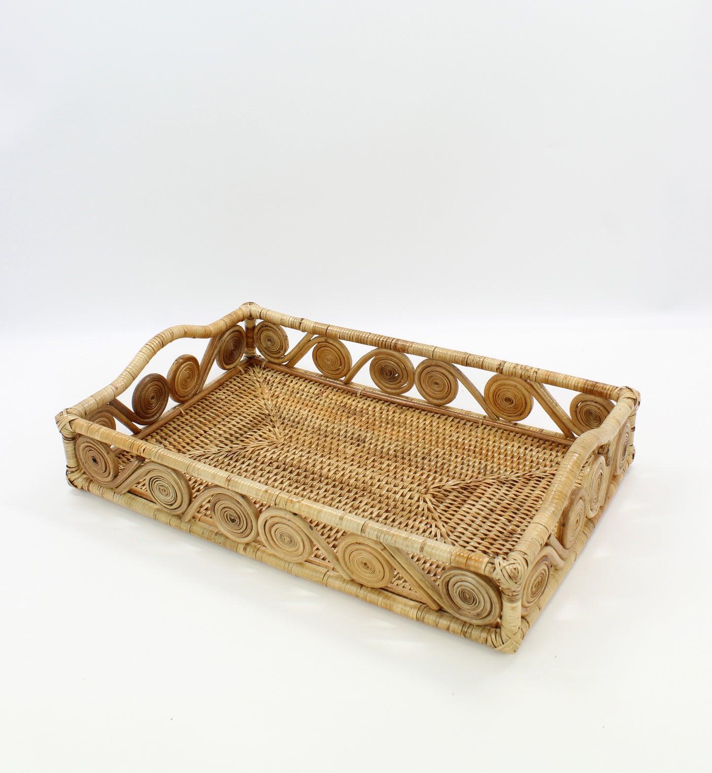 Natural rectangular rattan tray with swirl edge design, handmade for serving, organizing, or modern home décor styling.