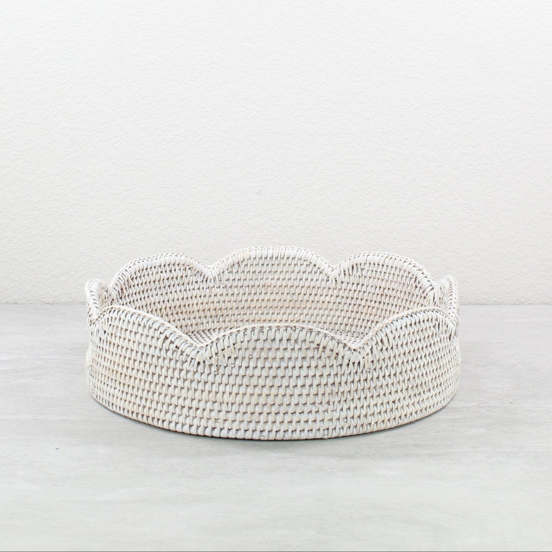 Whitewash scalloped round rattan tray handmade from Burmese rattan, shown empty against a neutral background.
