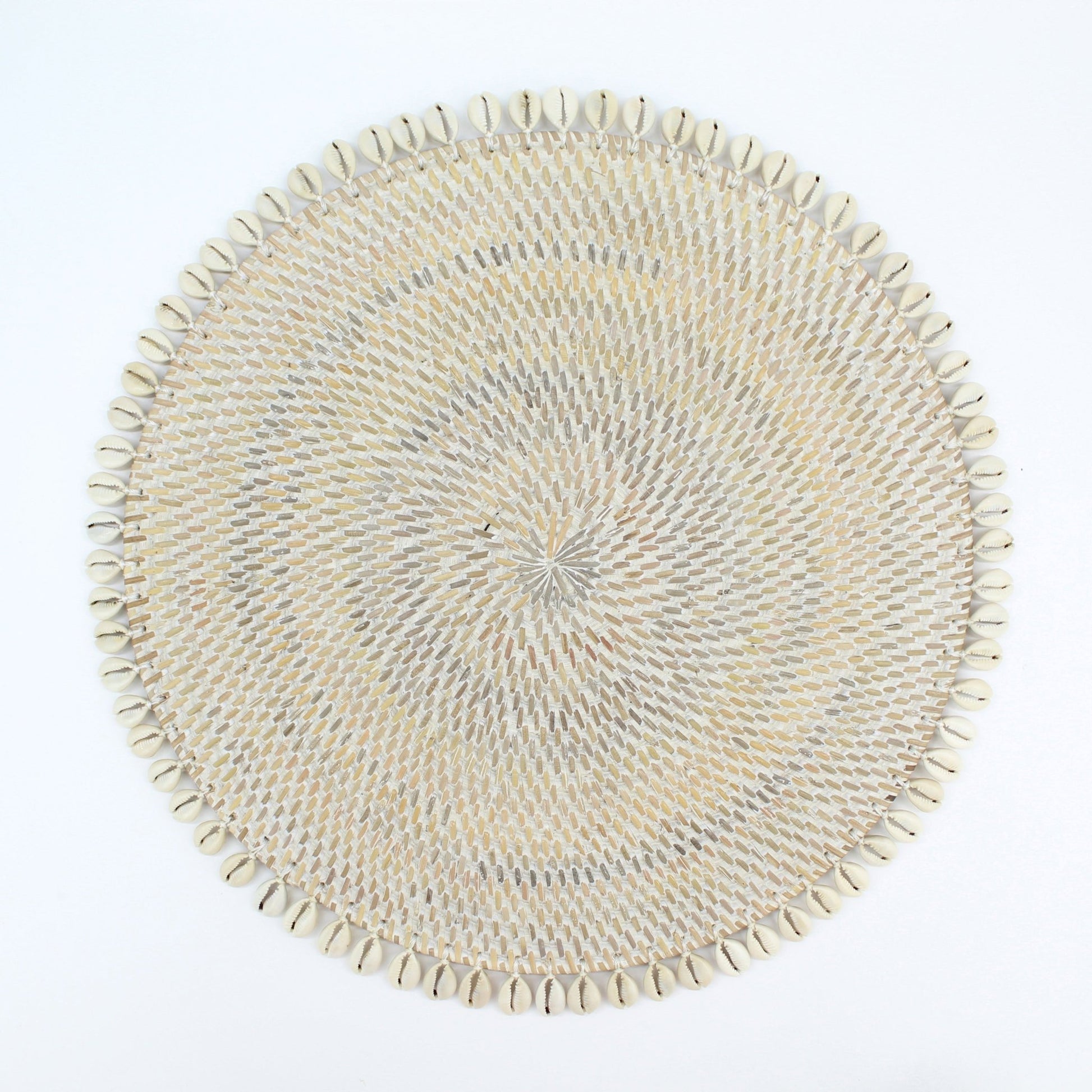 Handmade whitewash rattan placemat with natural seashell trim, shown on white background for clean, product-only display