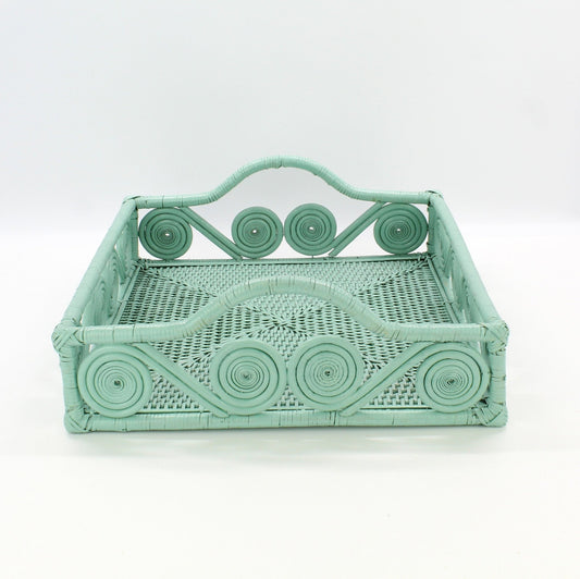 Eco Handcraft sage green swirl rattan tray on a light gray surface for home organization