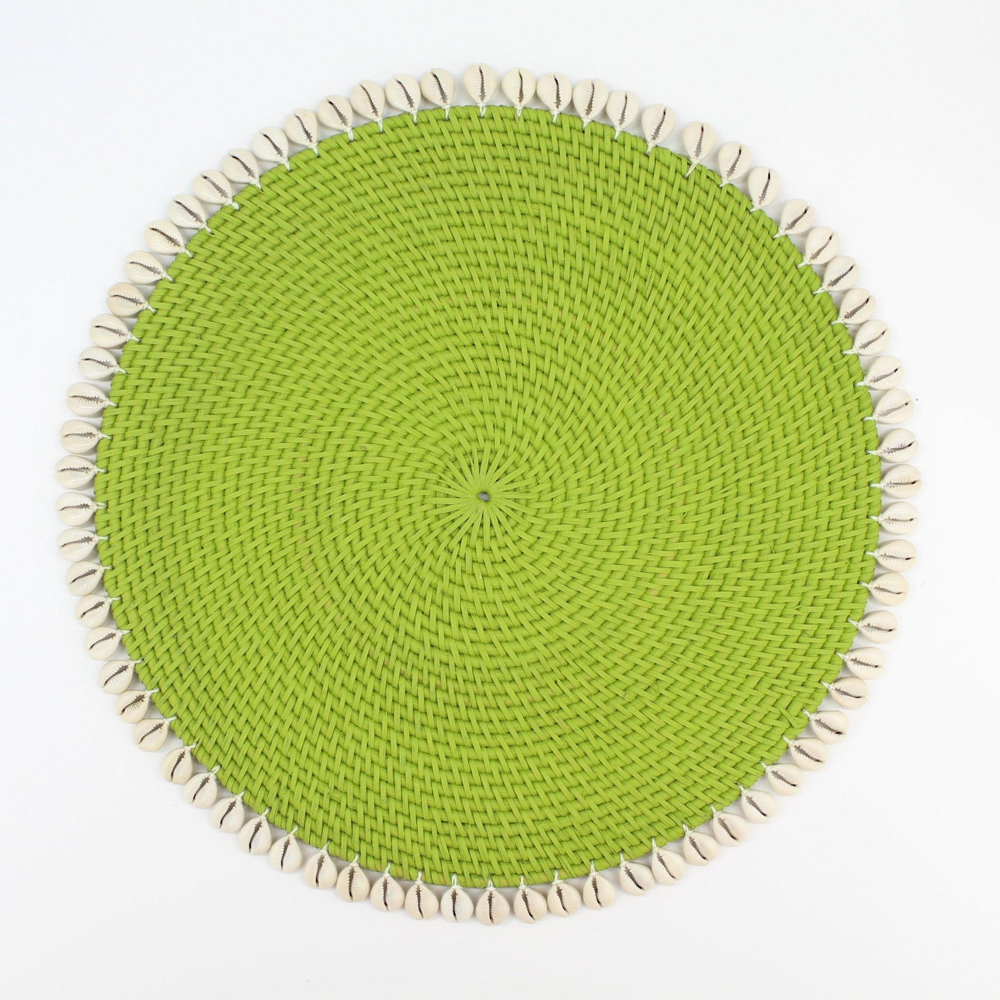 Handmade lime green rattan placemat with natural seashell trim, shown on white background for clean, product-only display
