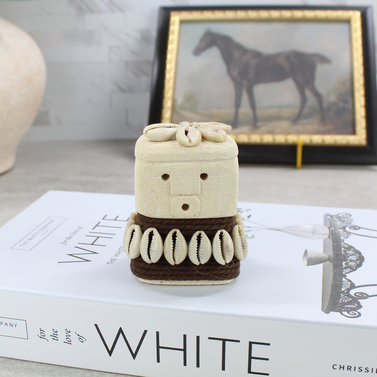 Balinese Sumba guardian figurine 8cm with dark rope waist and cowrie shell embellishments - handcrafted coastal home decor.