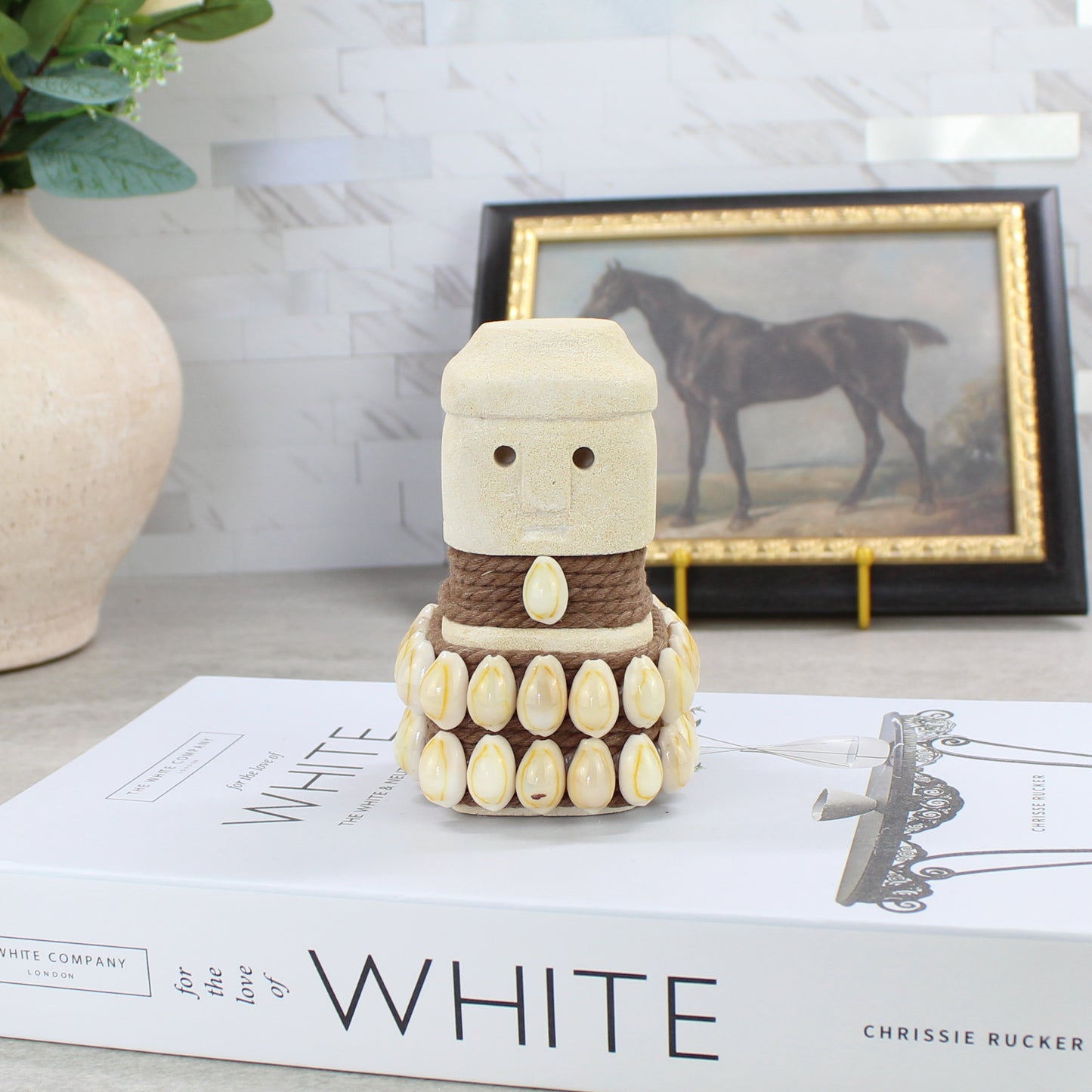 Balinese Sumba guardian figurine with dark rope waist and cowrie shell embellishments - handcrafted coastal home decor.