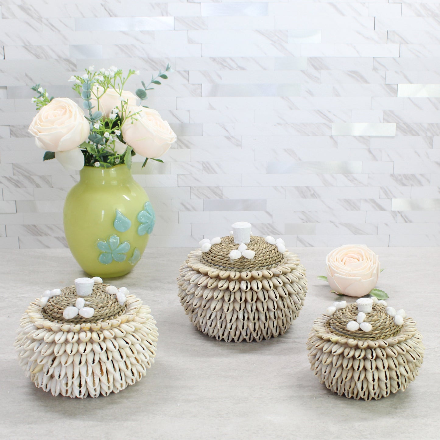 Collection of three handmade cowrie shell storage boxes in small, medium, and large sizes with rope lids – beach-inspired trinket holders