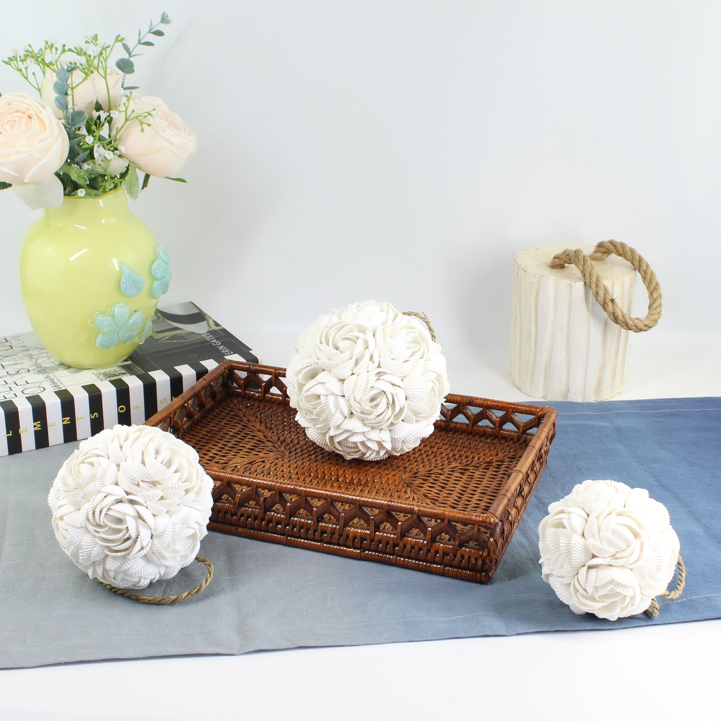 Set of small, medium, and large seashell rose balls displayed for coastal home styling.