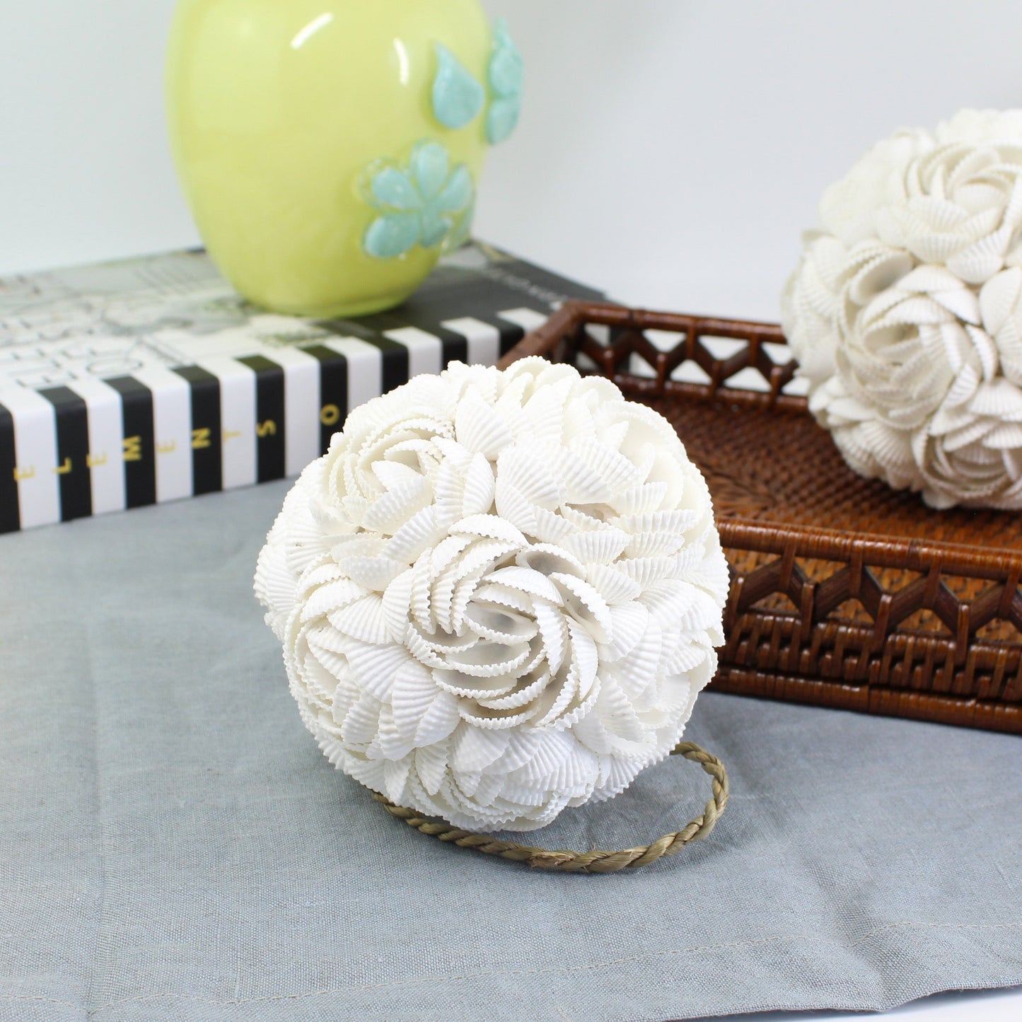 Medium handmade seashell rose ball with detailed shell rose design on table, perfect for modern coastal home and table decoration.