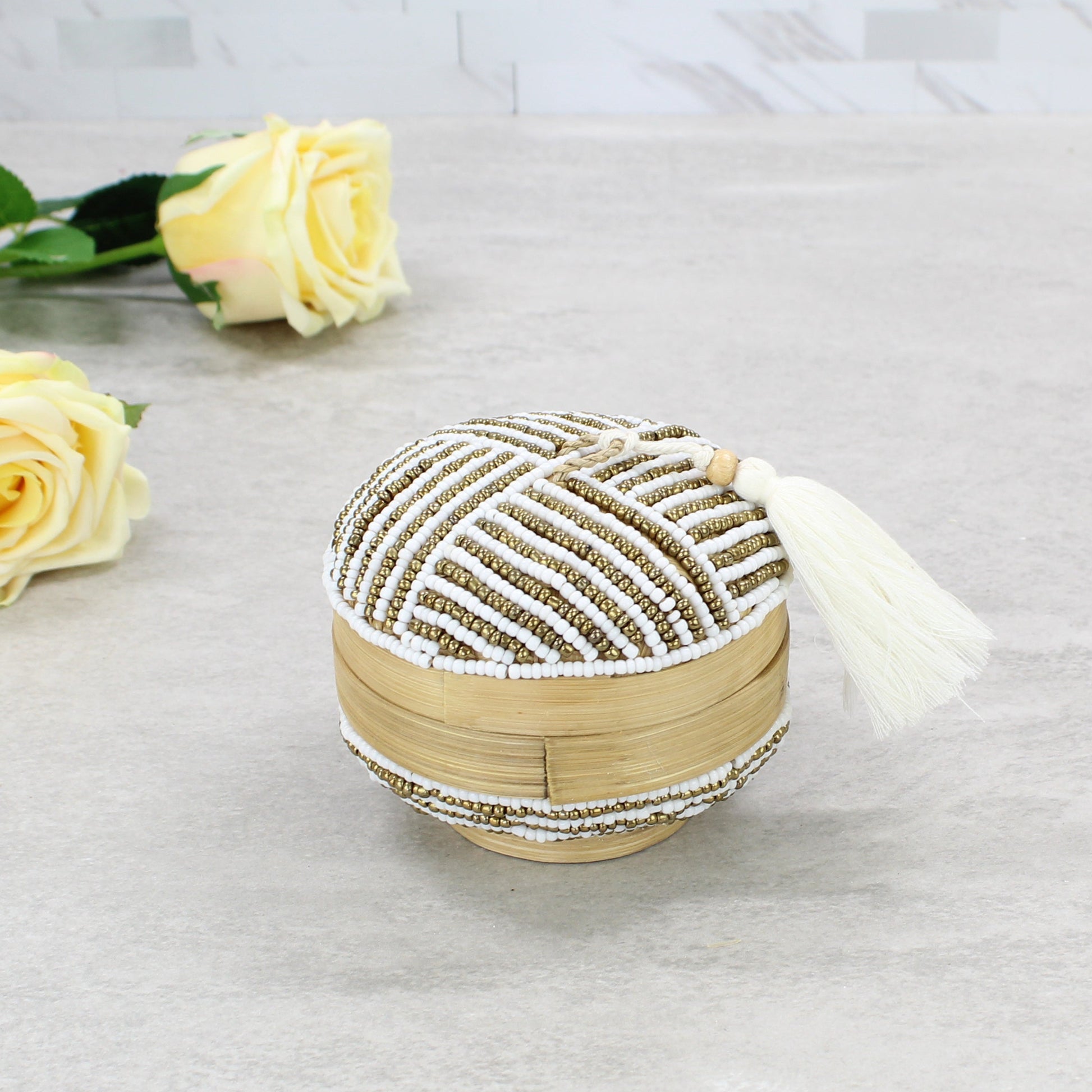 Eco Handcraft white and gold linear beaded bamboo jewelry box styled with yellow roses for coastal décor