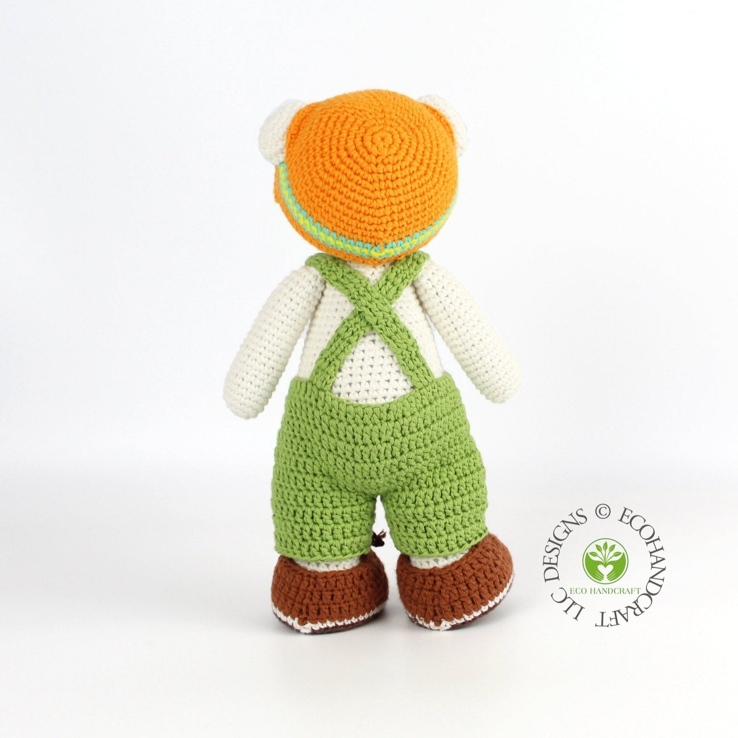 Eco Handcraft crochet polar bear toy showing back details with green overalls and orange hat, artisanal gift.