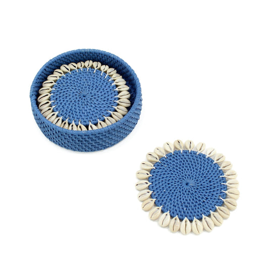 Blue rattan coasters with seashell trim displayed with holder for vibrant coastal décor.