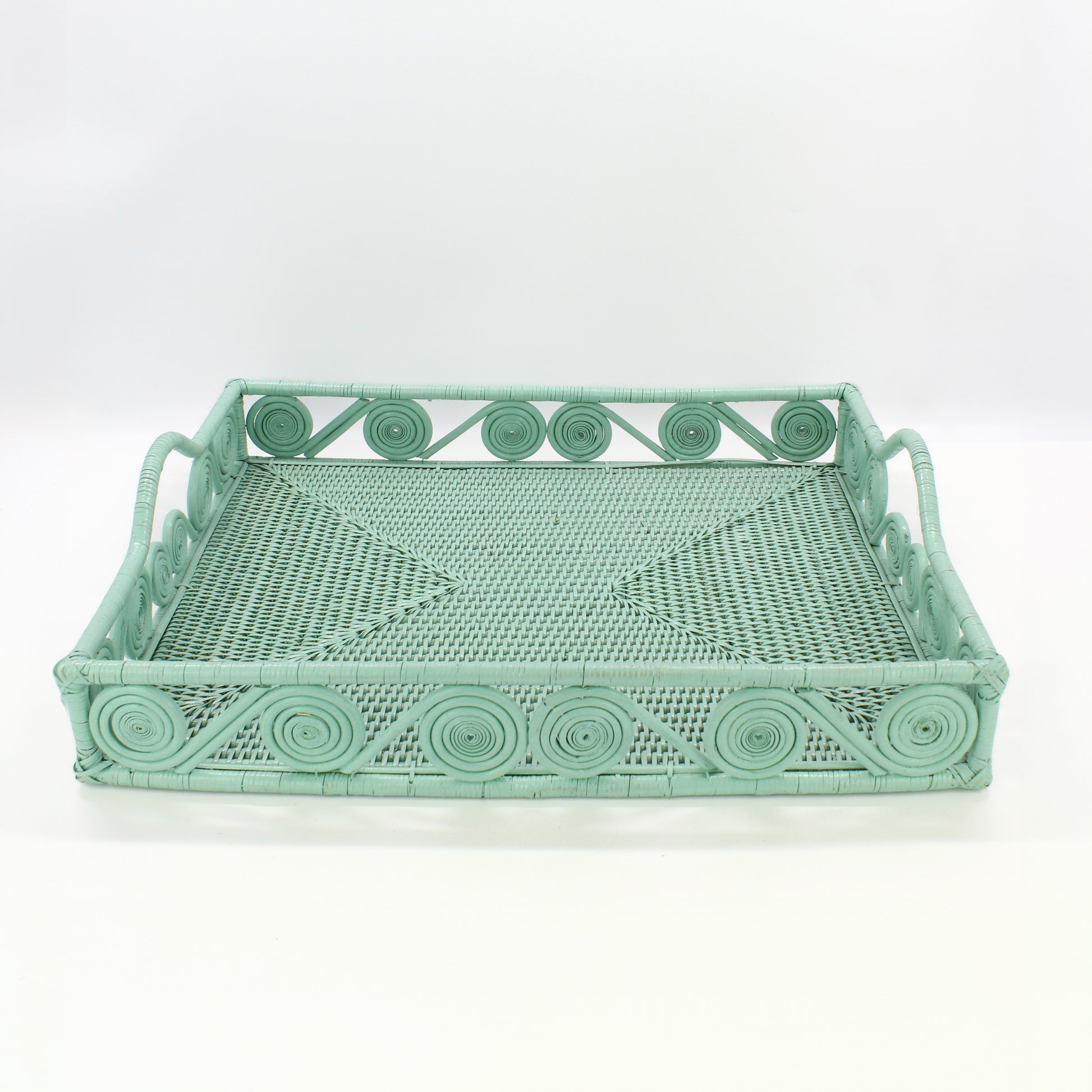 Front view of extra large rectangular swirly rattan tray in sage leaf green, artisan-crafted sustainable serving and organizing tray