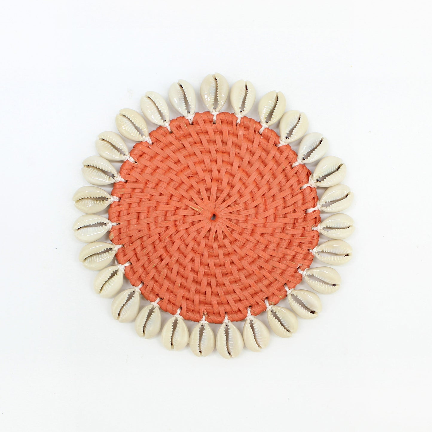 Single round orange rattan coaster with natural seashell edging, handmade eco-friendly coastal style table accessory