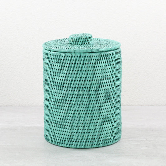 Turquoise round rattan waste bin with lid, tightly woven and handmade, shown on white background for product display.