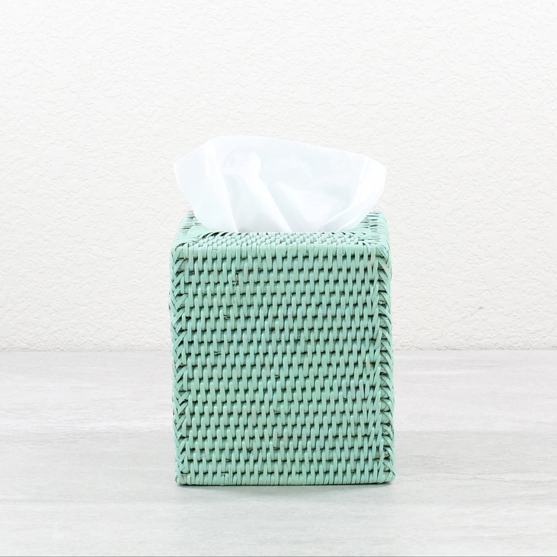 Sage leaf green square rattan tissue box cover displayed on a neutral background.