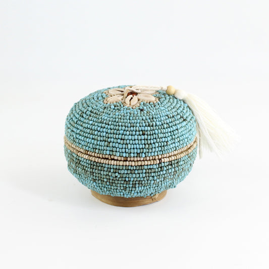 Artisan turquoise beaded seashell trinket box with ivory tassel and natural woven base, sustainable coastal home decor.