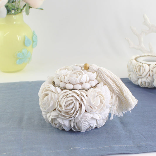 Handmade seashell rose storage box with tassel and wood accent, handmade from natural shells for coastal-inspired decorative storage.