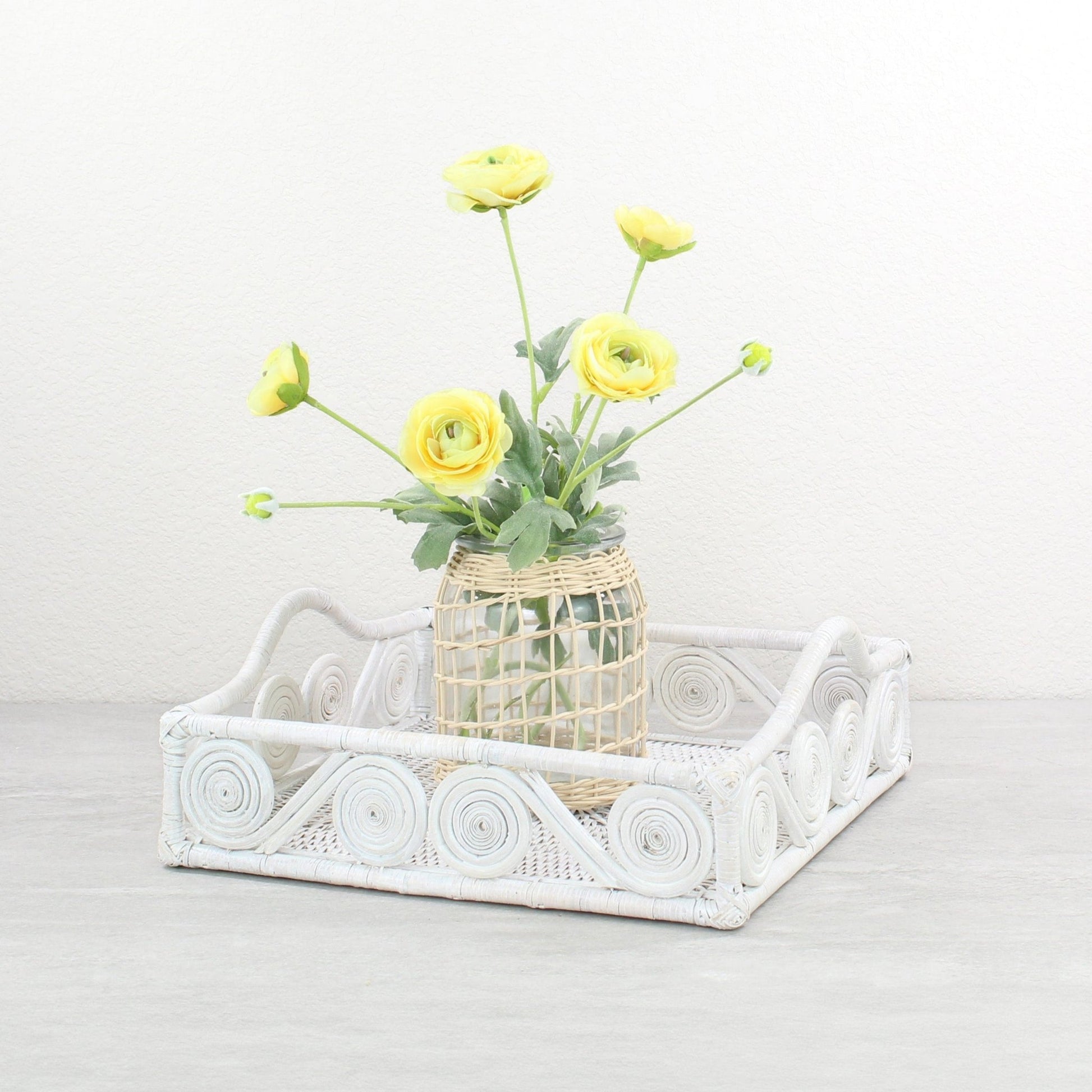 Eco Handcraft white spiral rattan tray styled with yellow flower vase – handmade, eco-luxe home decor accent