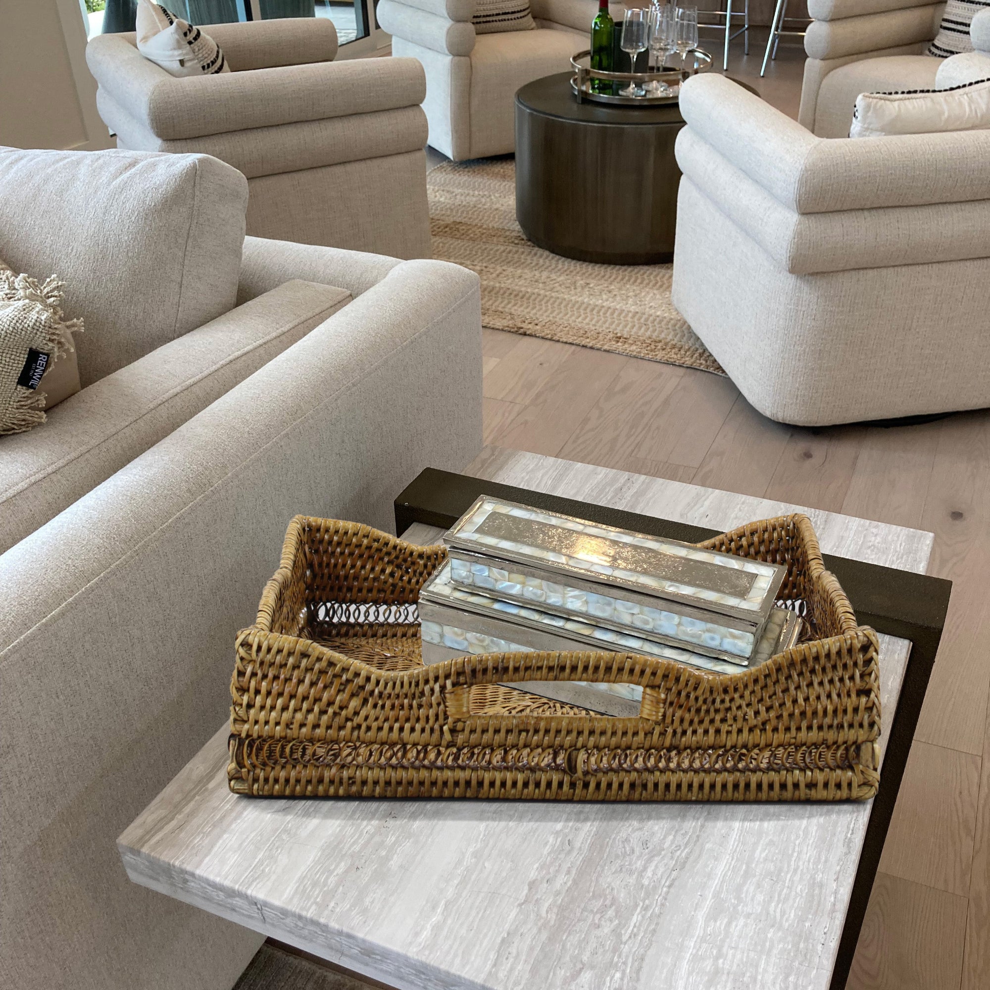 Eco Handcraft square rattan tray styled on a modern living room side table with books, decor, and cozy neutral chairs