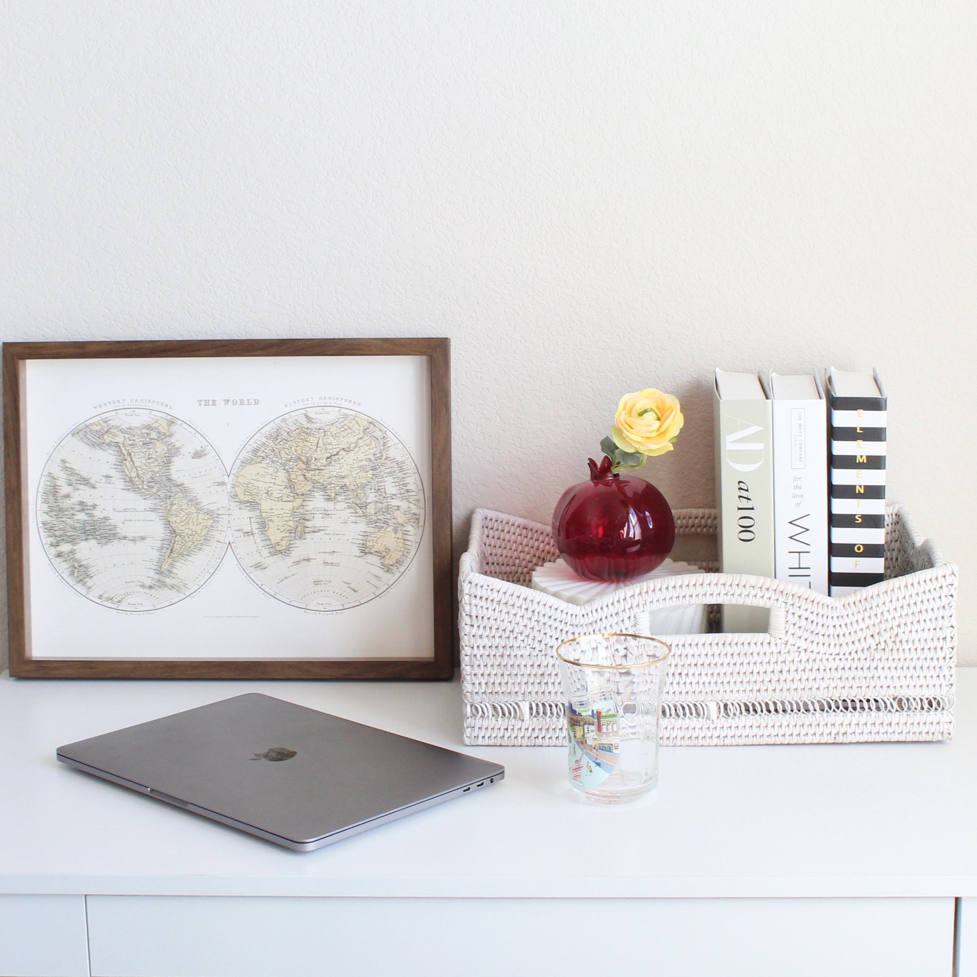 ECO HANDCRAFT whitewash rattan storage box styled with books, flowers, and decor on a modern white desk