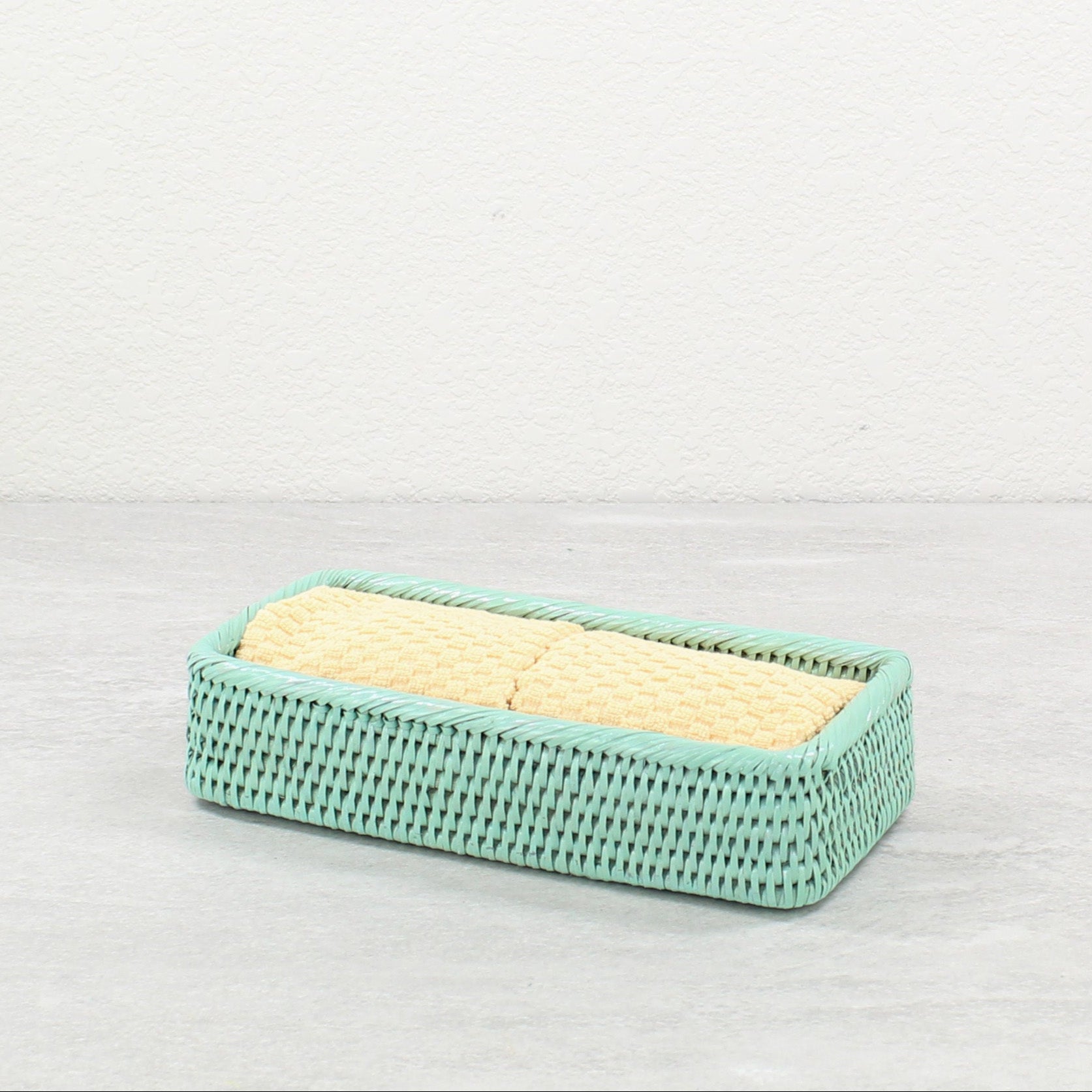 Small and medium sage leaf green rattan bathroom organizing trays with washing cloth, handwoven eco-friendly storage solution
