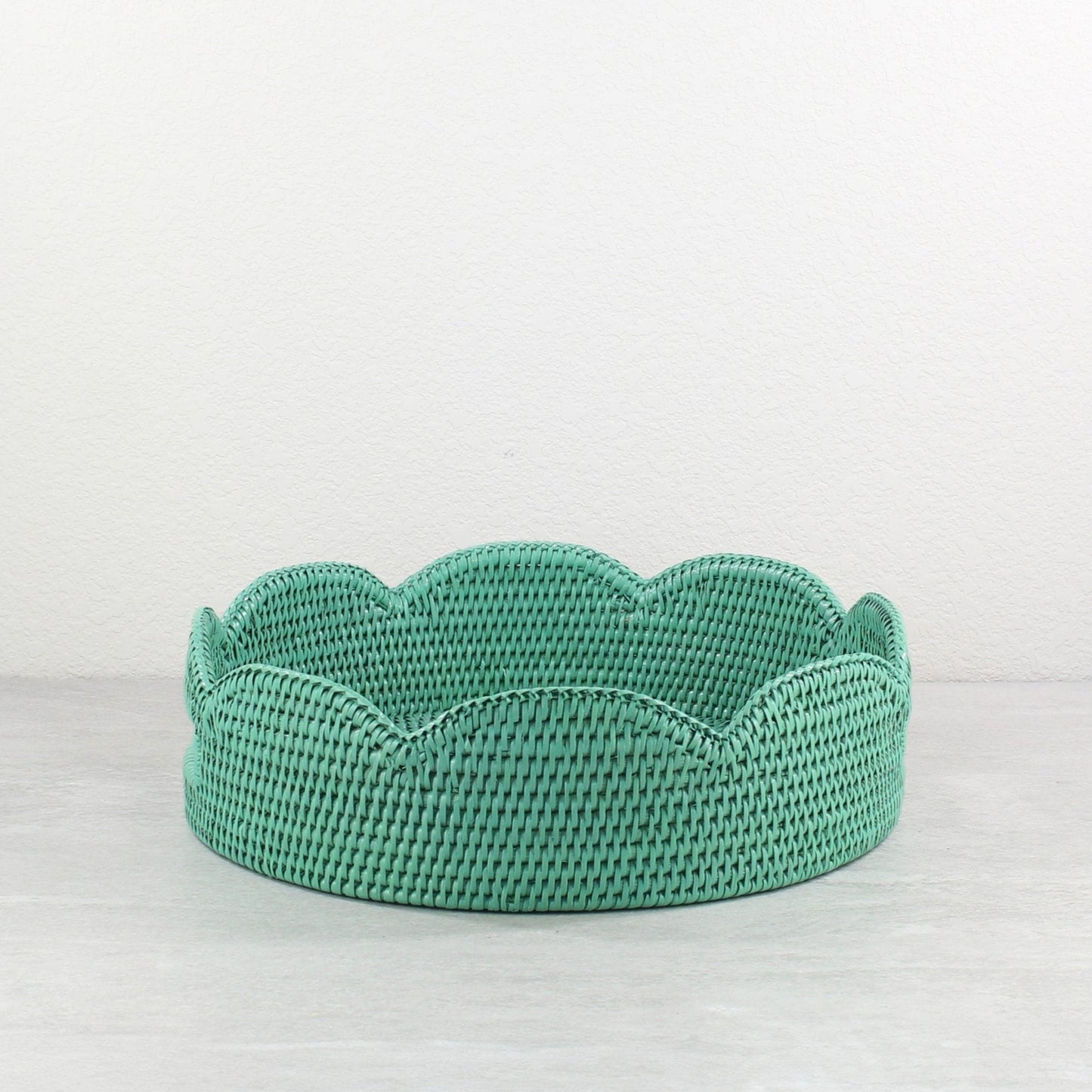 Turquoise scalloped round rattan tray handmade from Burmese rattan, shown empty against a neutral background.