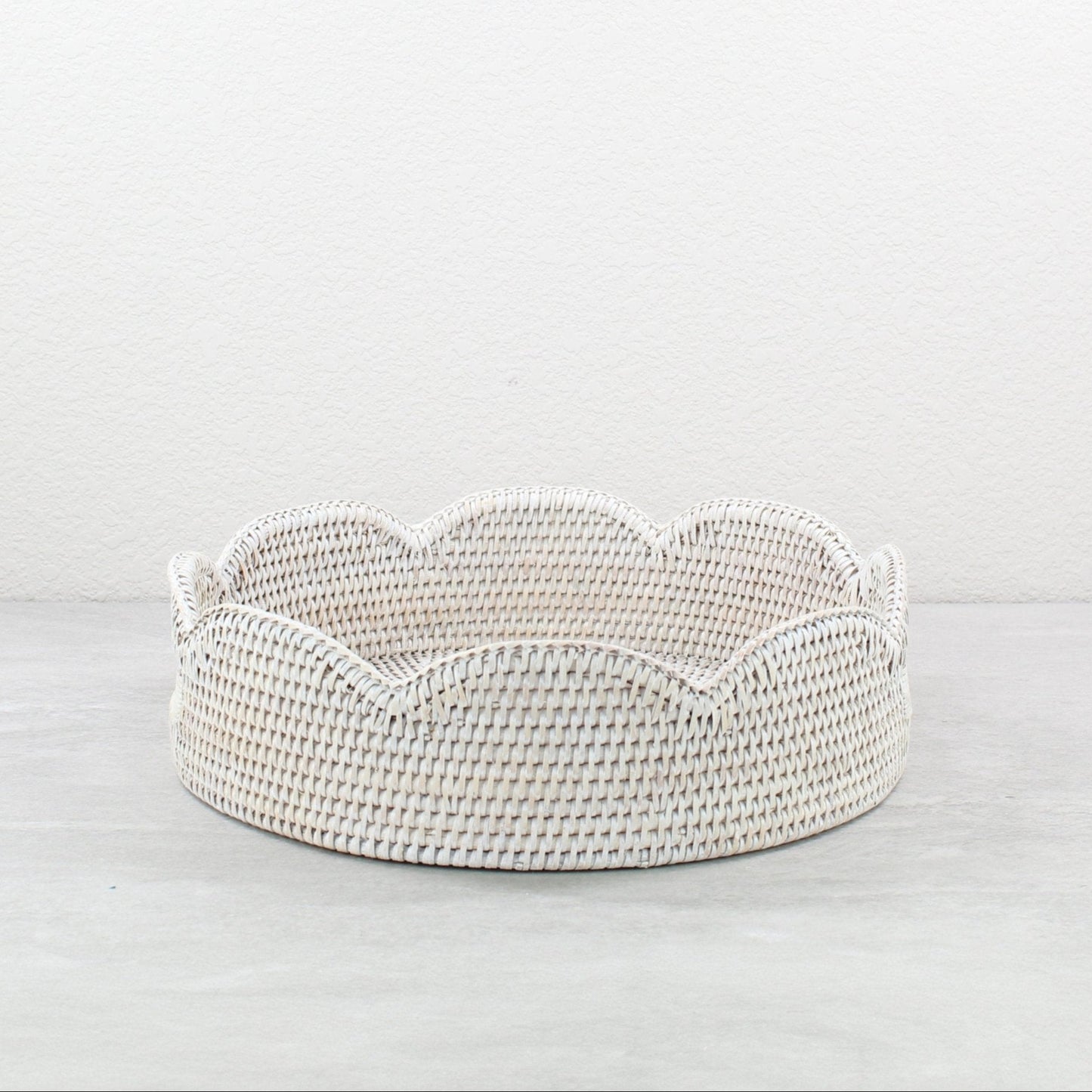 Whitewash scalloped round rattan tray handmade from Burmese rattan, shown empty against a neutral background.