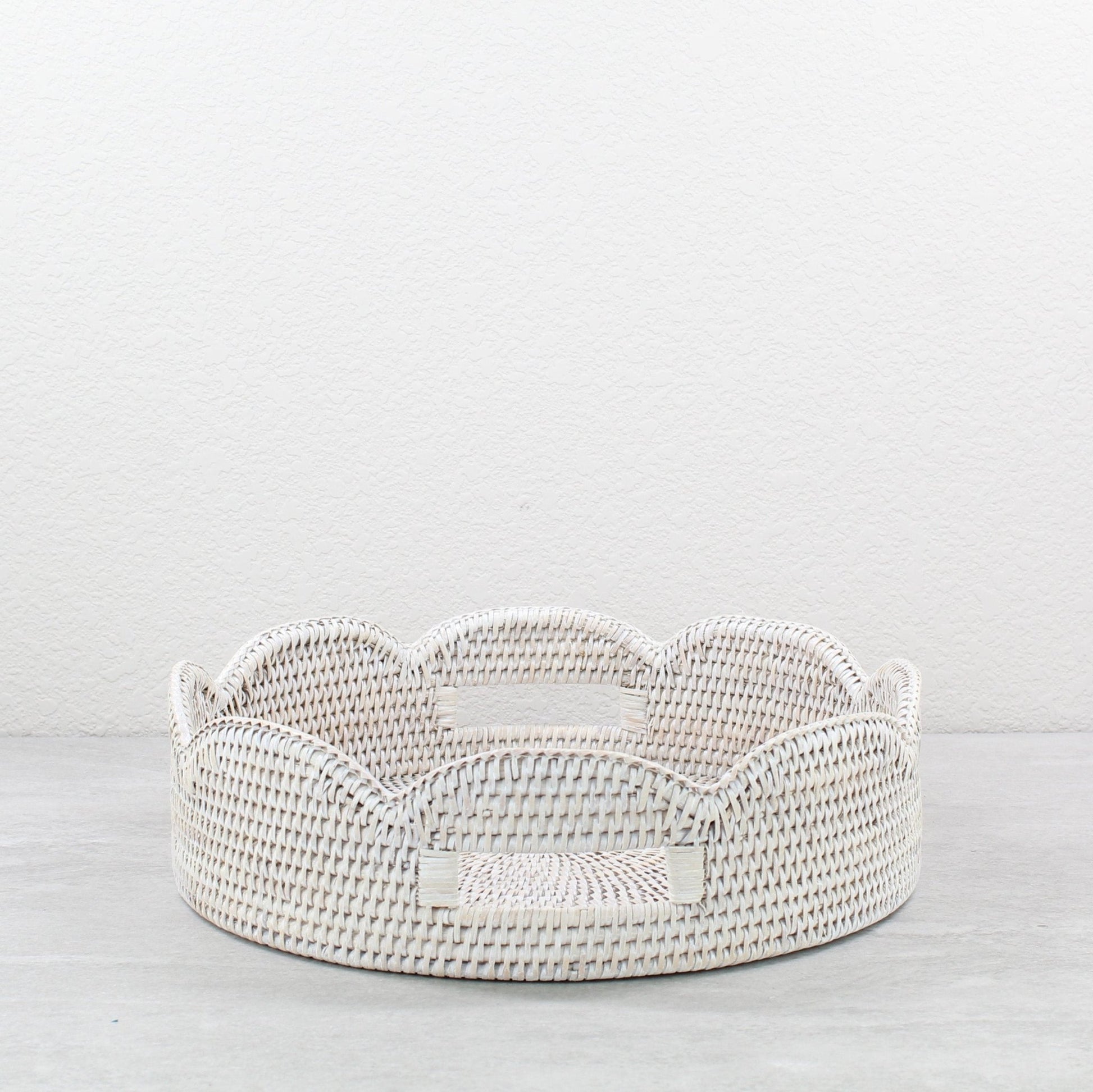 Whitewash scalloped round rattan tray handmade from Burmese rattan, shown empty as versatile decorative storage.