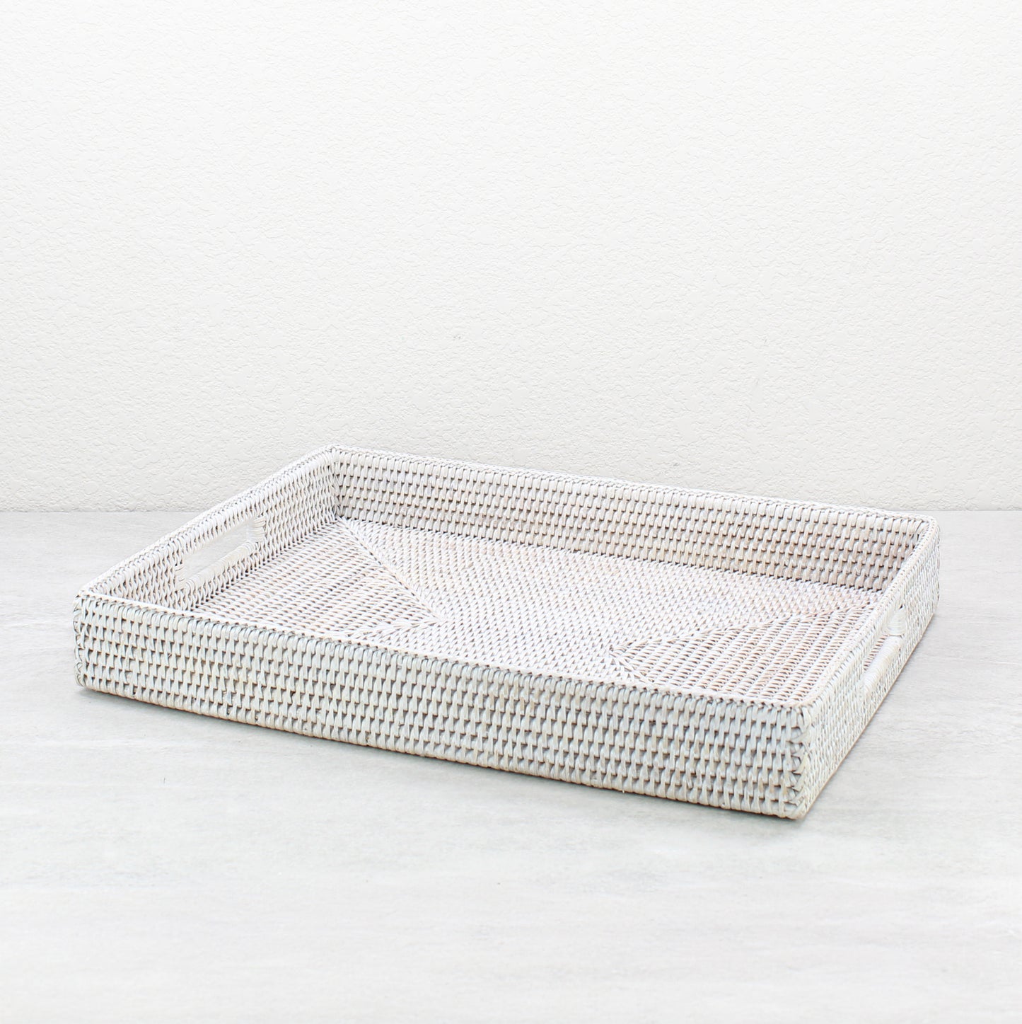 Handwoven whitewash rattan rectangular storage tray with handles, large size, eco-friendly organizer for coffee tables and countertops.